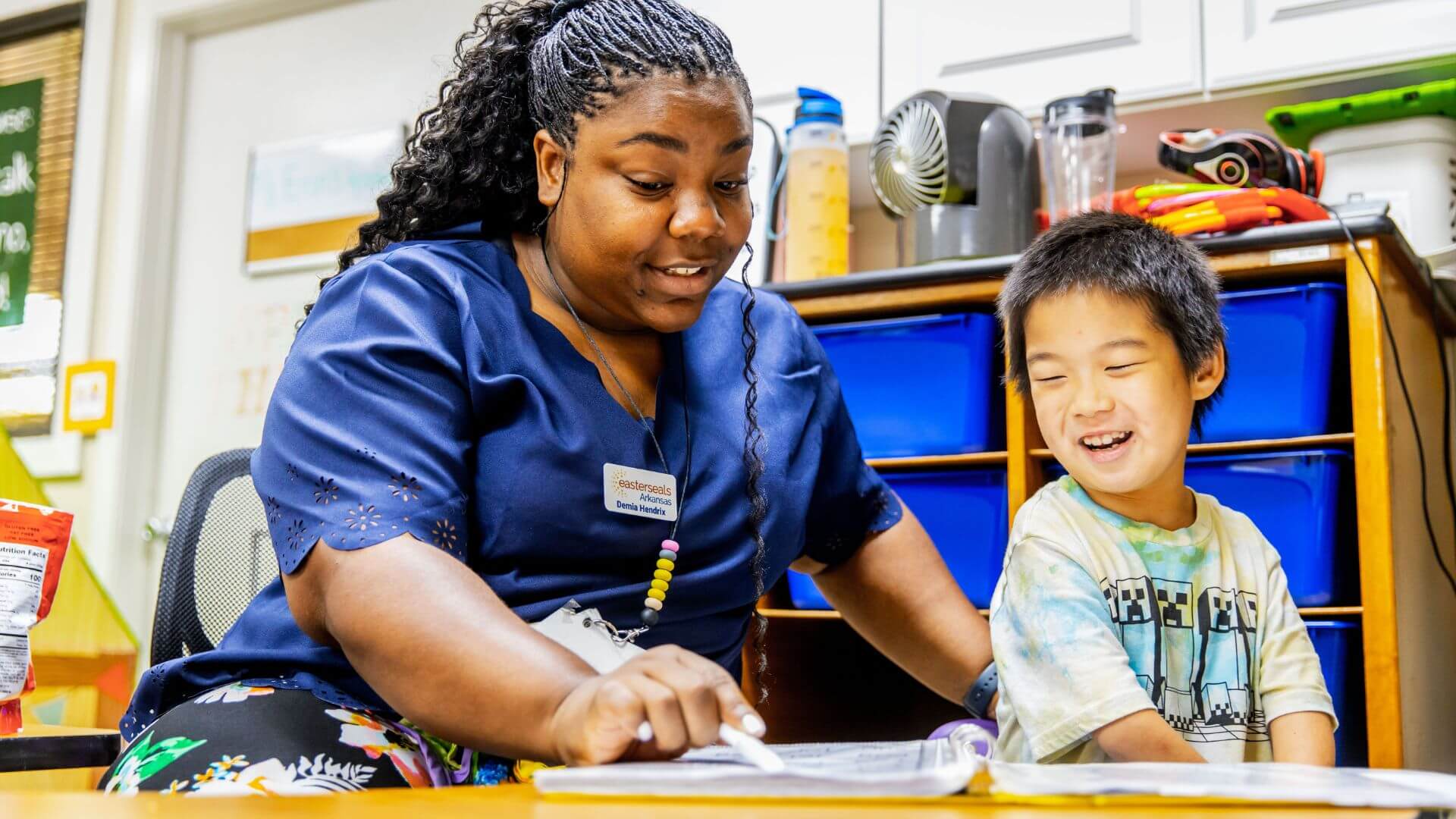 teacher with smiling child